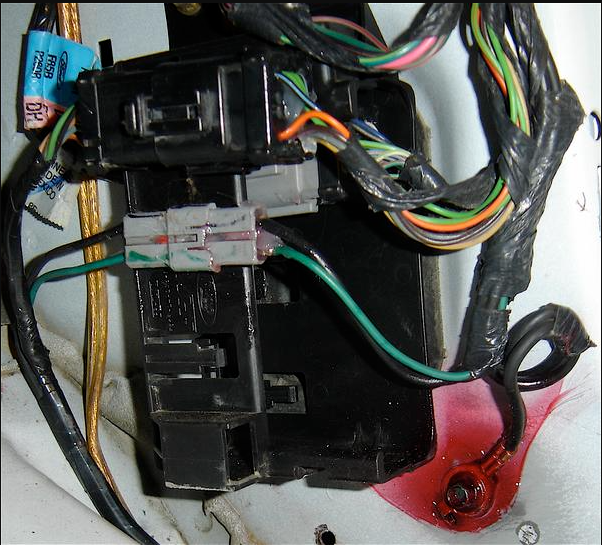 Ford vehicle wiring module, connectors, and chassis ground in the cabin